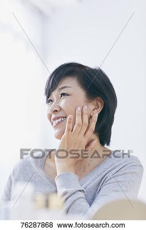 Japanese senior woman doing skin care View Large Photo Image Stock Photo - Japanese senior woman doing skin care. Fotosearch