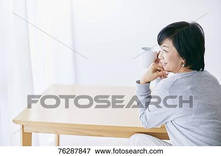 Japanese senior woman having coffee View Large Photo Image Stock Photo - Japanese senior woman having coffee. Fotosearch