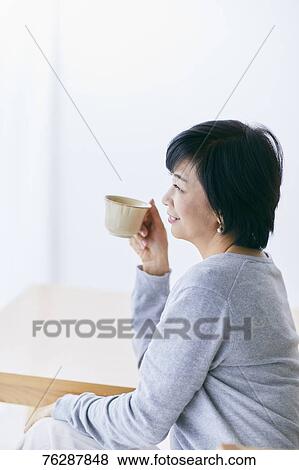 Japanese senior woman having coffee View Large Photo Image Stock Photo - Japanese senior woman having coffee. Fotosearch