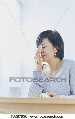 Japanese senior woman having headhache View Large Photo Image Stock Image - Japanese senior woman having headhache. Fotosearch