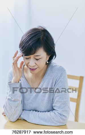 Japanese senior woman having headhache View Large Photo Image Stock Photo - Japanese senior woman having headhache. Fotosearch