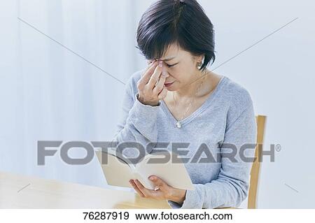 Japanese senior woman having headhache View Large Photo Image Stock Photo - Japanese senior woman having headhache. Fotosearch