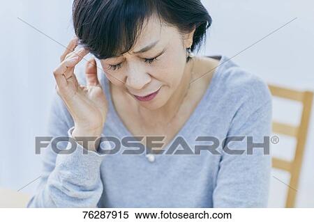 Japanese senior woman having headhache View Large Photo Image Stock Photography - Japanese senior woman having headhache. Fotosearch