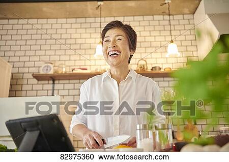 Japanese senior woman in the kitchen View Large Photo Image Stock Image - Japanese senior woman in the kitchen. Fotosearch