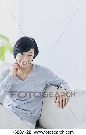 Japanese senior woman on sofa View Large Photo Image Stock Image - Japanese senior woman on sofa. Fotosearch