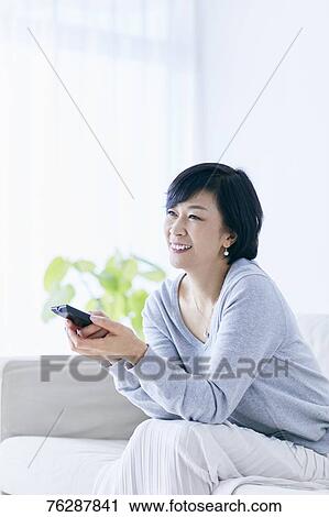 Japanese senior woman on sofa View Large Photo Image Stock Image - Japanese senior woman on sofa. Fotosearch