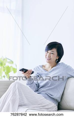 Japanese senior woman on sofa View Large Photo Image Stock Image - Japanese senior woman on sofa. Fotosearch