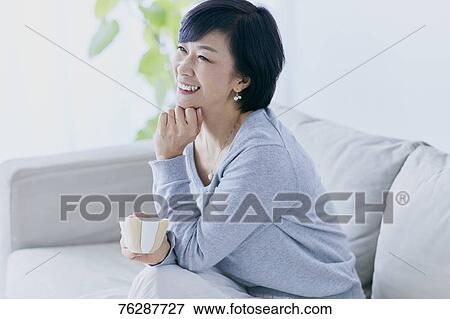 Japanese senior woman on sofa View Large Photo Image Stock Photo - Japanese senior woman on sofa. Fotosearch