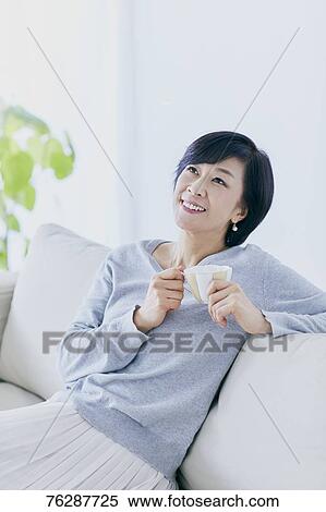 Japanese senior woman on sofa View Large Photo Image Stock Photography - Japanese senior woman on sofa. Fotosearch
