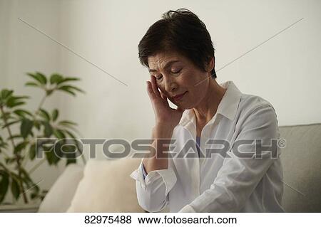 Japanese senior woman on the sofa View Large Photo Image Stock Photo - Japanese senior woman on the sofa. Fotosearch