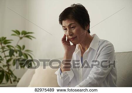 Japanese senior woman on the sofa View Large Photo Image Stock Photo - Japanese senior woman on the sofa. Fotosearch