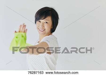 Stock Image - Japanese senior woman training. Fotosearch
