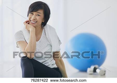 Stock Image - Japanese senior woman training. Fotosearch