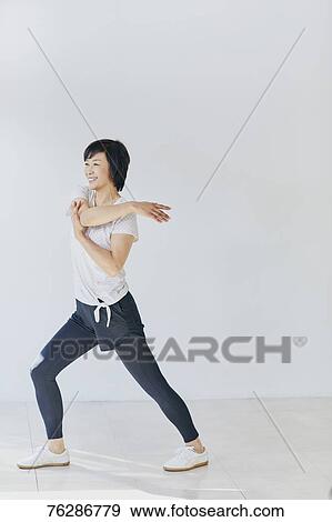 Stock Photo - Japanese senior woman training. Fotosearch