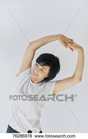 Stock Photo - Japanese senior woman training. Fotosearch