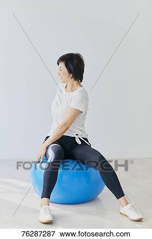 Stock Photo - Japanese senior woman training. Fotosearch