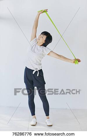 Stock Photograph - Japanese senior woman training. Fotosearch