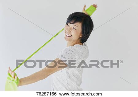Stock Photograph - Japanese senior woman training. Fotosearch