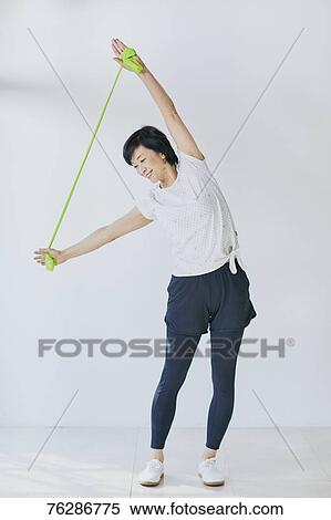 Stock Photography - Japanese senior woman training. Fotosearch