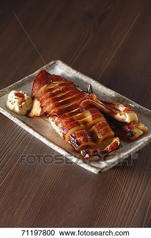 Stock Image - Japanese style grilled squid. Fotosearch
