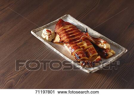 Japanese style grilled squid View Large Photo Image Stock Image - Japanese style grilled squid. Fotosearch