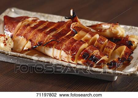 Stock Image - Japanese style grilled squid. Fotosearch