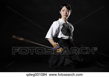 Japanese traditional archery athlete against black background View Large Photo Image Picture - Japanese traditional archery athlete against black background. Fotosearch