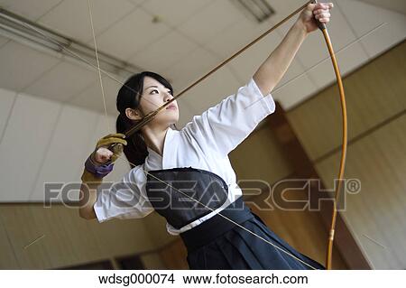 Picture - Japanese traditional archery athlete practicing. Fotosearch