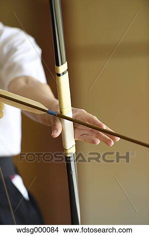 Picture - Japanese traditional archery athlete practicing. Fotosearch