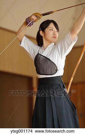Picture - Japanese traditional archery athlete practicing. Fotosearch