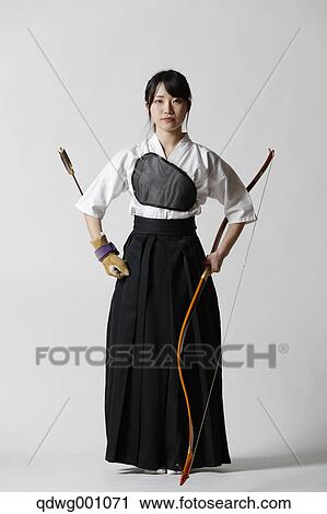 Japanese traditional archery athlete against white background View Large Photo Image Stock Image - Japanese traditional archery athlete against white background. Fotosearch