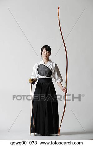 Japanese traditional archery athlete against white background View Large Photo Image Stock Image - Japanese traditional archery athlete against white background. Fotosearch