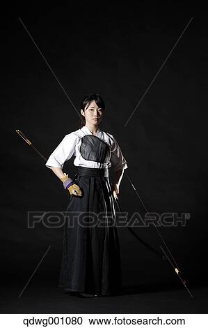Japanese traditional archery athlete against black background View Large Photo Image Stock Image - Japanese traditional archery athlete against black background. Fotosearch