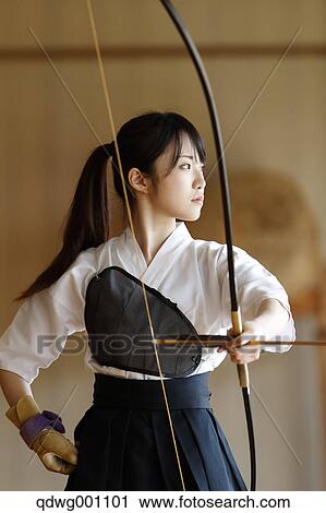 Stock Image - Japanese traditional archery athlete practicing. Fotosearch