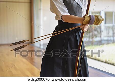 Stock Image - Japanese traditional archery athlete practicing. Fotosearch