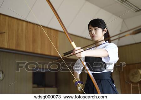 Stock Image - Japanese traditional archery athlete practicing. Fotosearch