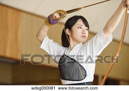 Japanese traditional archery athlete practicing View Large Photo Image Stock Image - Japanese traditional archery athlete practicing. Fotosearch