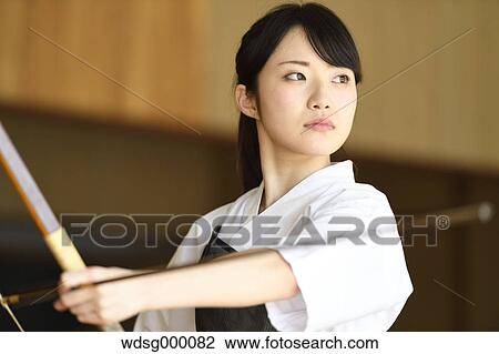 Stock Image - Japanese traditional archery athlete practicing. Fotosearch