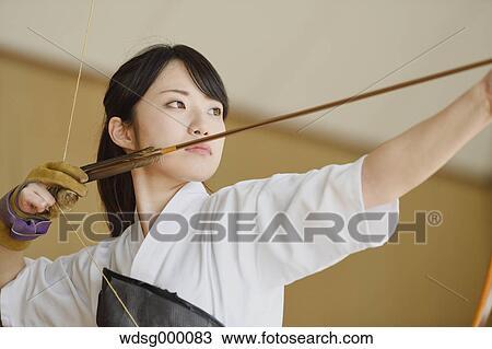 Stock Image - Japanese traditional archery athlete practicing. Fotosearch