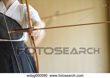 Japanese traditional archery athlete practicing View Large Photo Image Stock Image - Japanese traditional archery athlete practicing. Fotosearch
