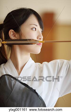 Japanese traditional archery athlete practicing View Large Photo Image Stock Image - Japanese traditional archery athlete practicing. Fotosearch