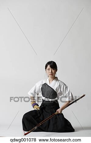 Japanese traditional archery athlete against white background View Large Photo Image Stock Photo - Japanese traditional archery athlete against white background. Fotosearch