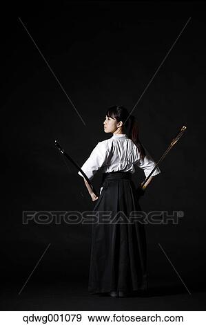 Japanese traditional archery athlete against black background View Large Photo Image Stock Photo - Japanese traditional archery athlete against black background. Fotosearch