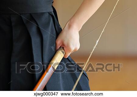 Japanese traditional archery athlete hand holding bow View Large Photo Image Stock Photo - Japanese traditional archery athlete hand holding bow. Fotosearch