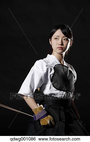 Japanese traditional archery athlete against black background View Large Photo Image Stock Photograph - Japanese traditional archery athlete against black background. Fotosearch