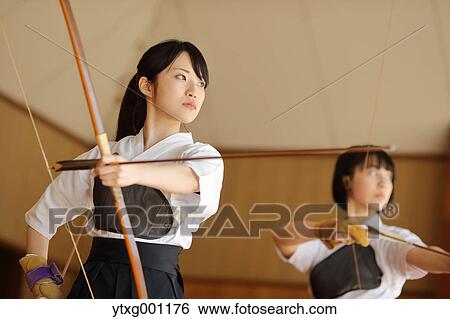 Japanese traditional archery athletes practicing View Large Photo Image Stock Photograph - Japanese traditional archery athletes practicing. Fotosearch
