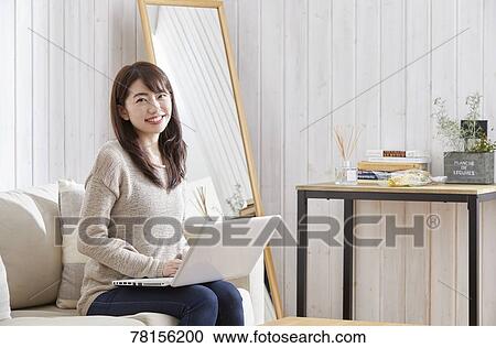 Japanese woman buying online View Large Photo Image Stock Image - Japanese woman buying online. Fotosearch