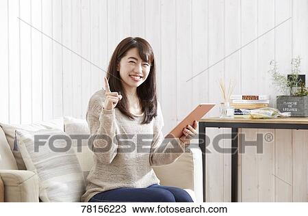 Japanese woman buying online View Large Photo Image Stock Image - Japanese woman buying online. Fotosearch
