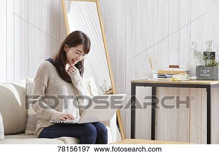 Japanese woman buying online View Large Photo Image Stock Photo - Japanese woman buying online. Fotosearch
