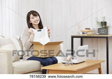 Japanese woman buying online View Large Photo Image Stock Photo - Japanese woman buying online. Fotosearch